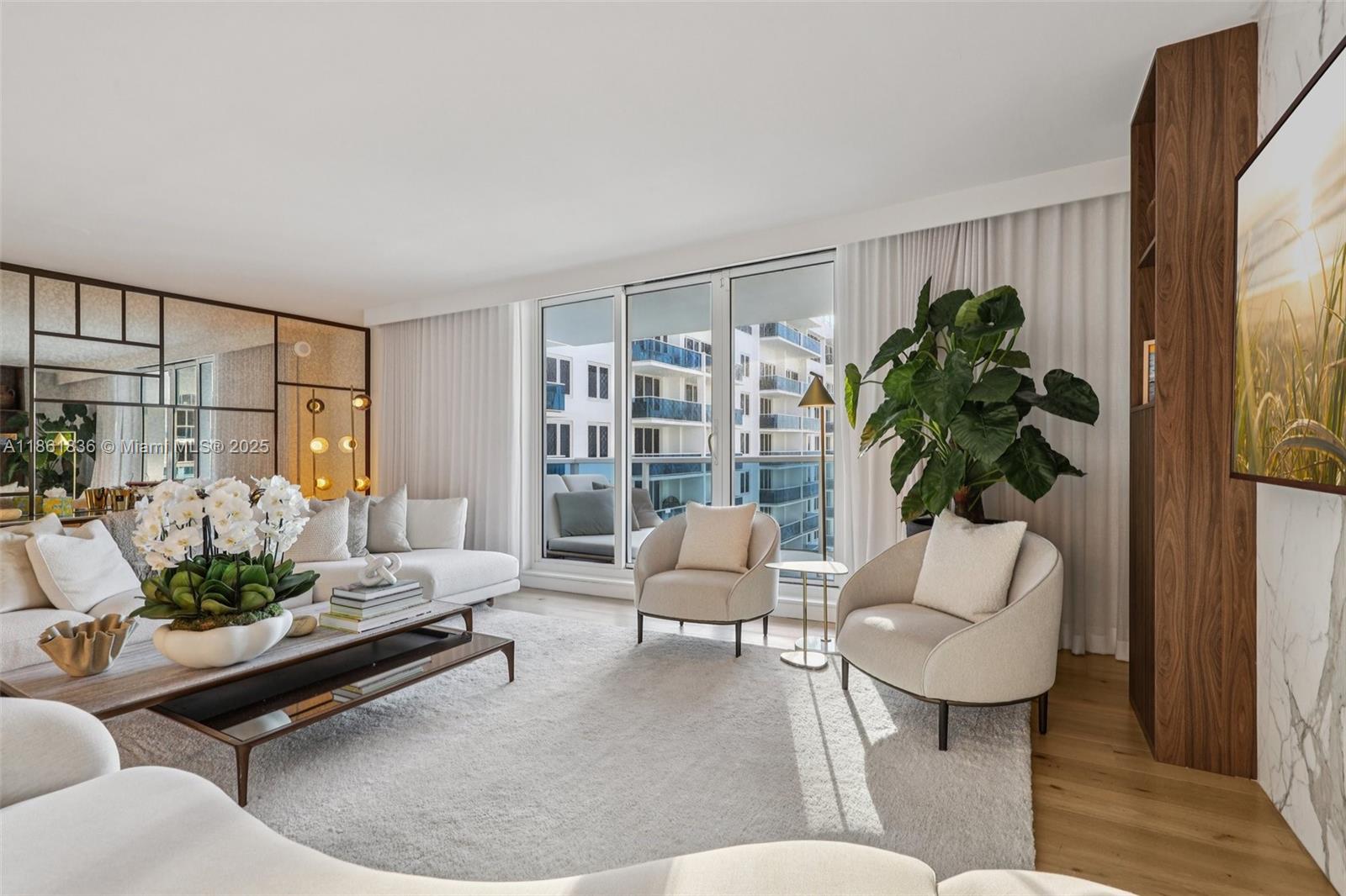102 24th Street, Unit 1440 Miami Beach, FL 33139 - Photo 3 of 78 a living room with furniture plant and a potted plant