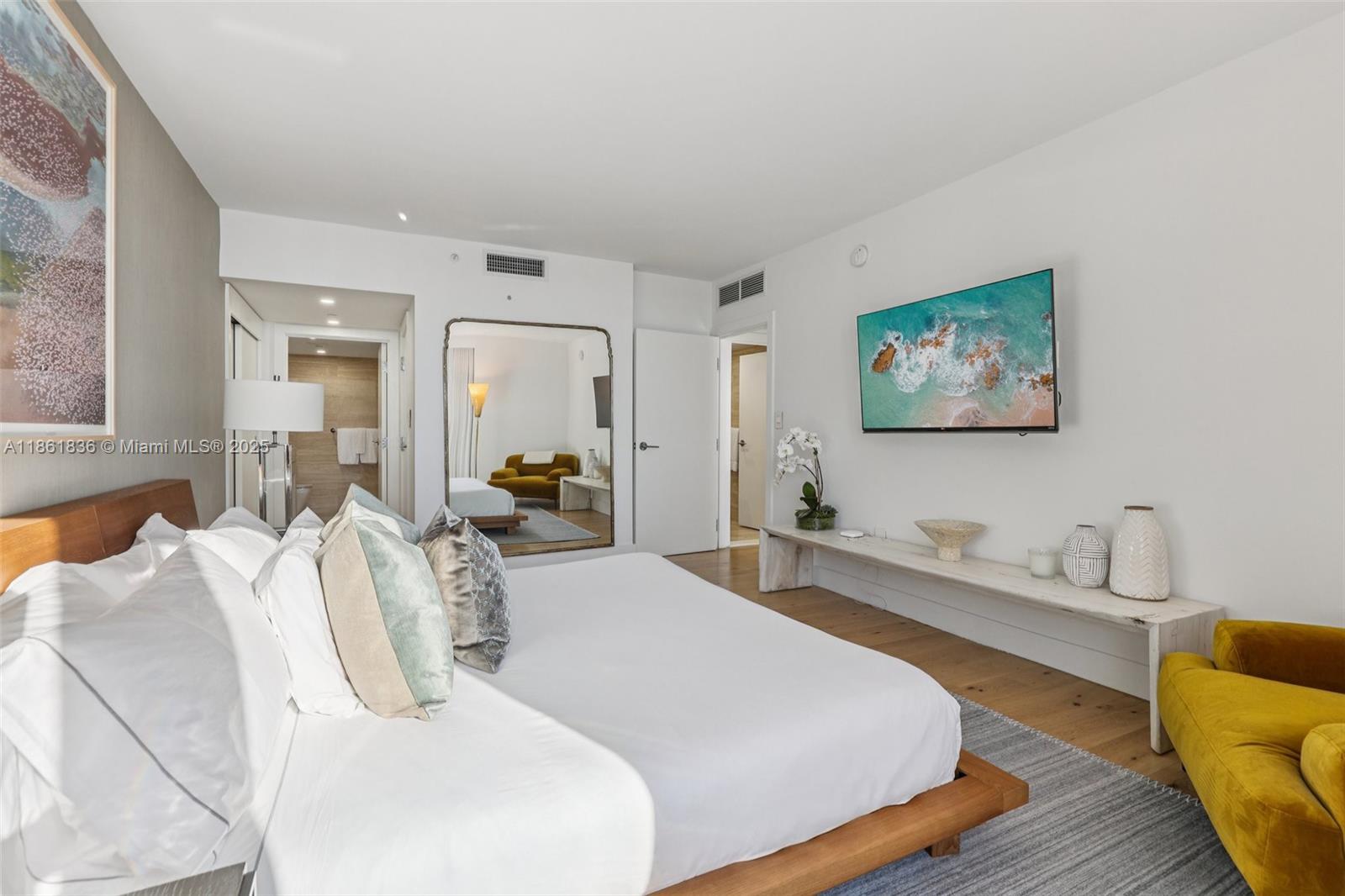 102 24th Street, Unit 1440 Miami Beach, FL 33139 - Photo 35 of 78 a bedroom with a bed and a couch