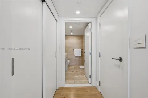 a view of a chair and tables in the balcony