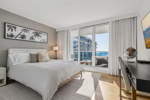 a room with gym equipment and a large window