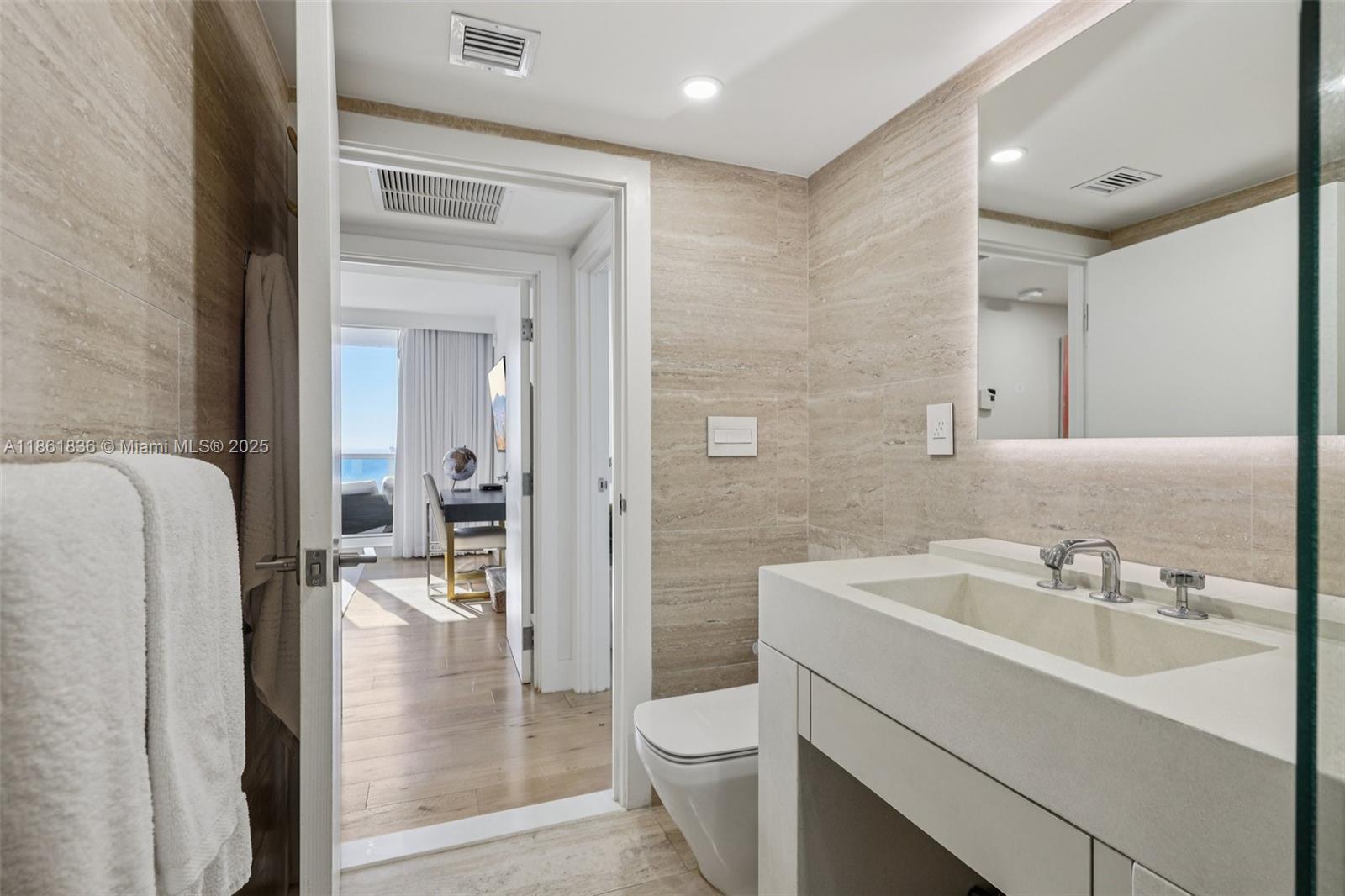 102 24th Street, Unit 1440 Miami Beach, FL 33139 - Photo 44 of 78 a bathroom with a sink a toilet and shower