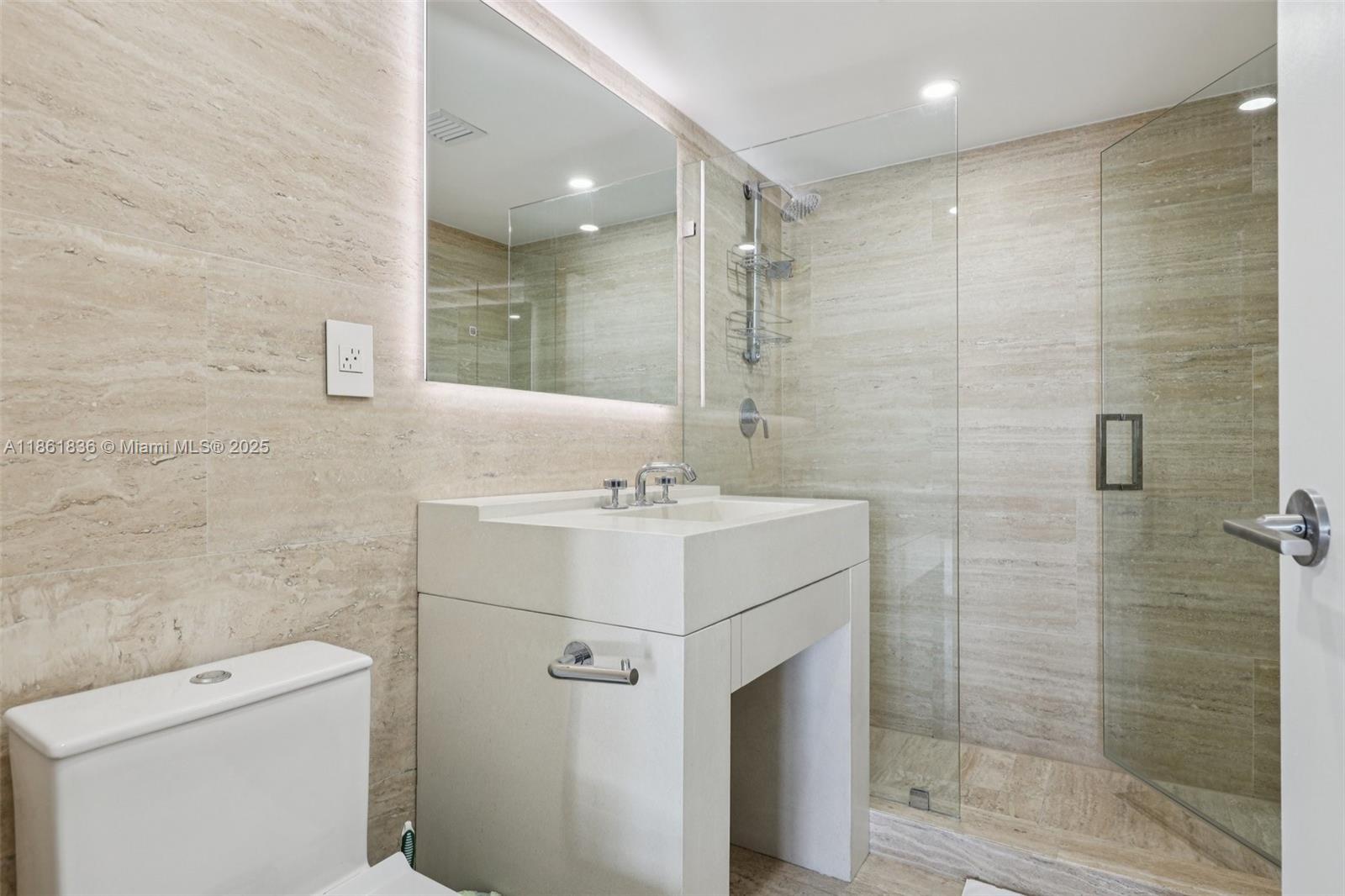 102 24th Street, Unit 1440 Miami Beach, FL 33139 - Photo 46 of 78 a bathroom with a sink toilet and shower