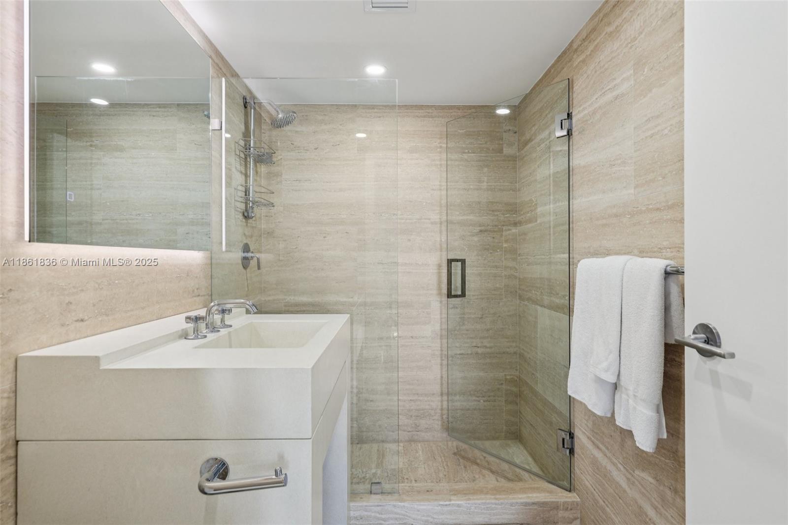 102 24th Street, Unit 1440 Miami Beach, FL 33139 - Photo 47 of 78 a bathroom with a shower and a sink