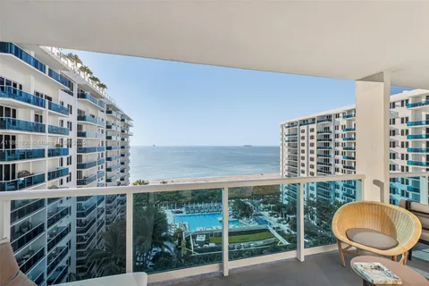 a view of outdoor space with seating area and lake view