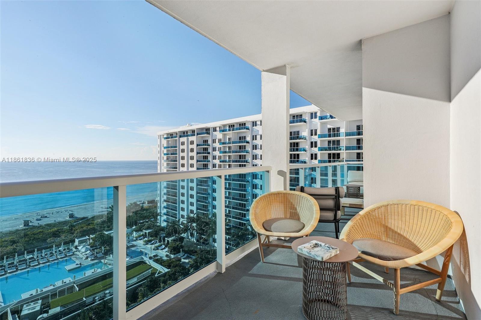 102 24th Street, Unit 1440 Miami Beach, FL 33139 - Photo 49 of 78 a view of a chair and tables in the balcony