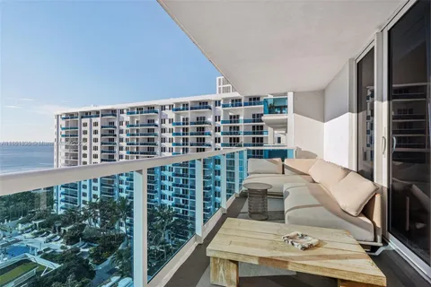 a view of a terrace with furniture and potted plants