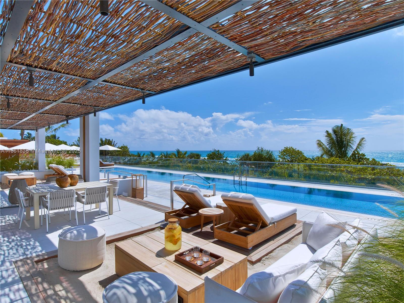 102 24th Street, Unit 1440 Miami Beach, FL 33139 - Photo 66 of 78 a view of swimming pool with lounge chairs