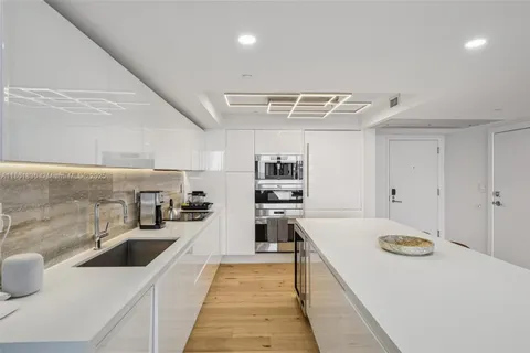 a view of a dining room with furniture wooden floor and a rug