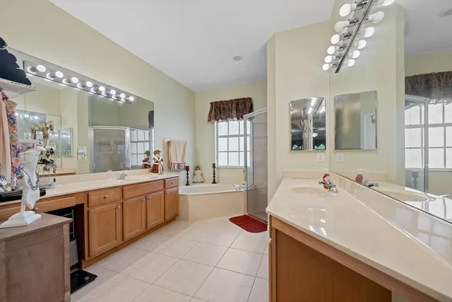 a large kitchen with a sink and cabinets