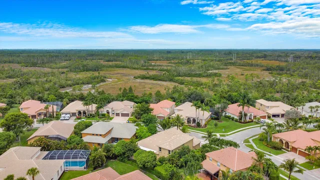 an aerial view of a house with garden space and street view