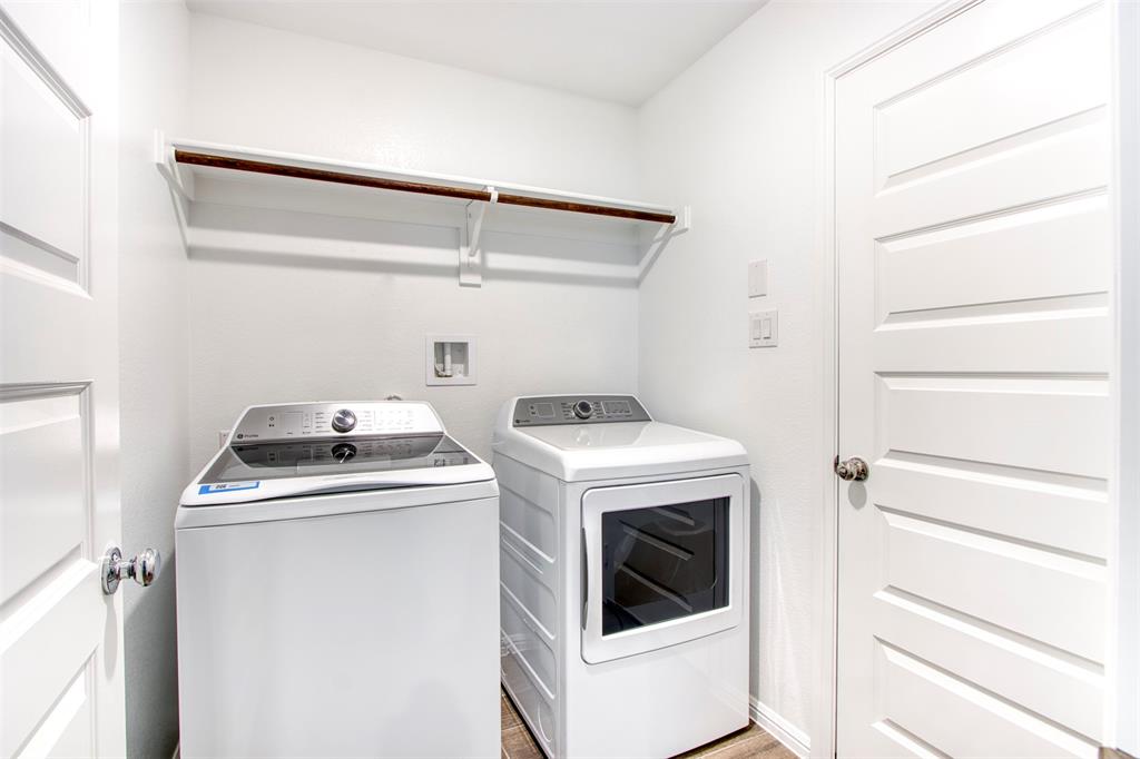 7108 Calshot Road Pilot Point, TX 76258 - Photo 16 of 28 Laundry room with washer/dryer.
