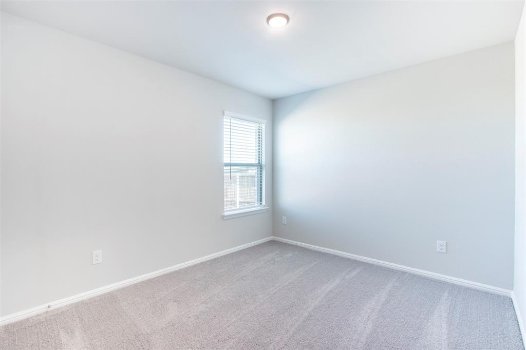 7108 Calshot Road Pilot Point, TX 76258 - Photo 22 of 28 Secondary bedroom.