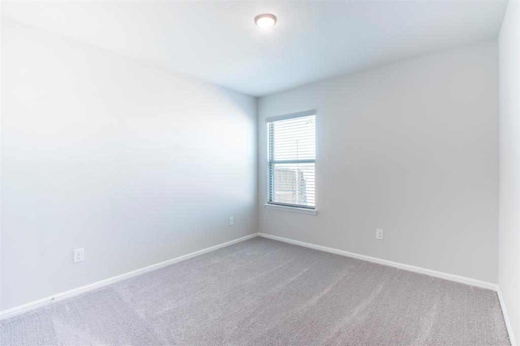 7108 Calshot Road Pilot Point, TX 76258 - Photo 23 of 28 Secondary bedroom.