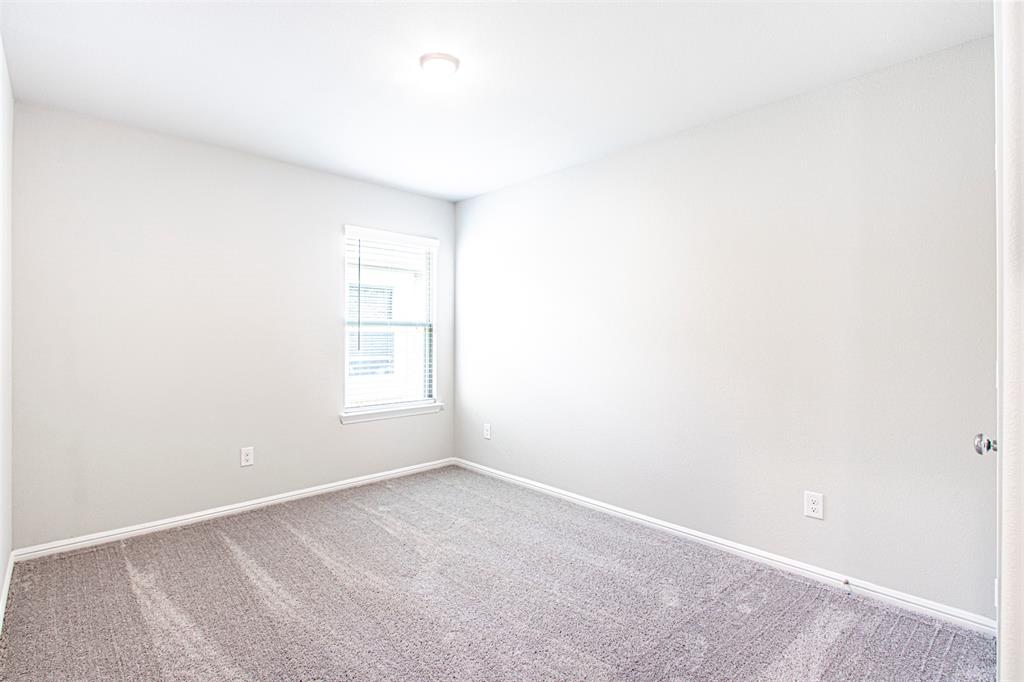 7108 Calshot Road Pilot Point, TX 76258 - Photo 25 of 28 Secondary bedroom.