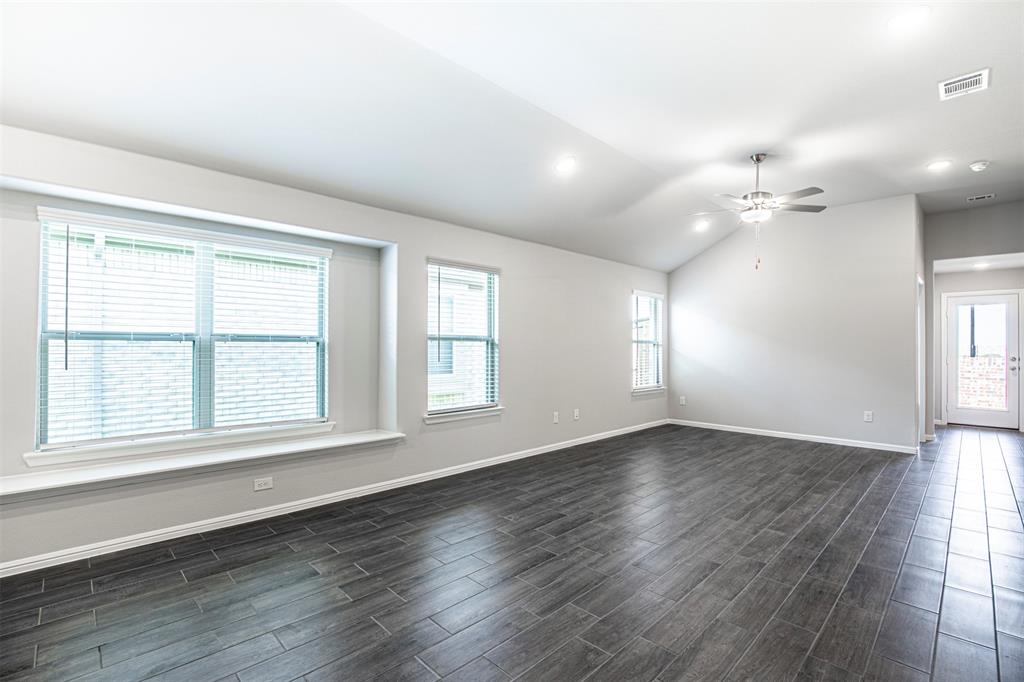 7108 Calshot Road Pilot Point, TX 76258 - Photo 6 of 28 Spacious living room with ceiling fan.