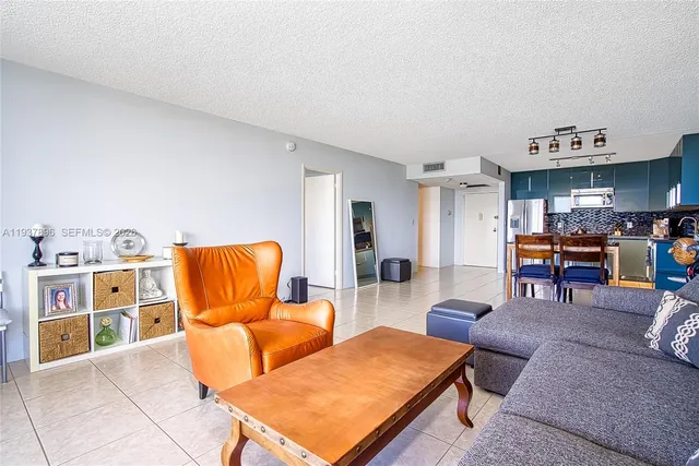 a bedroom with a bed lamp and window