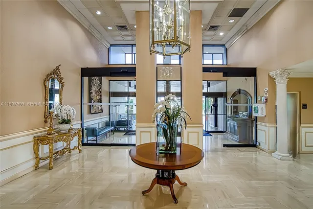 a view of a building with lake view and tall buildings