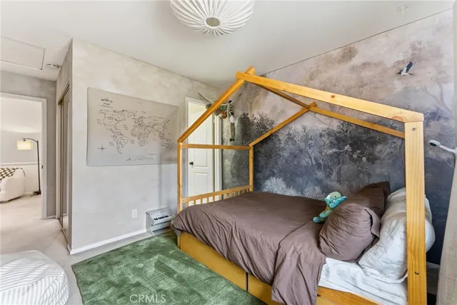 a bedroom with a bed and balcony