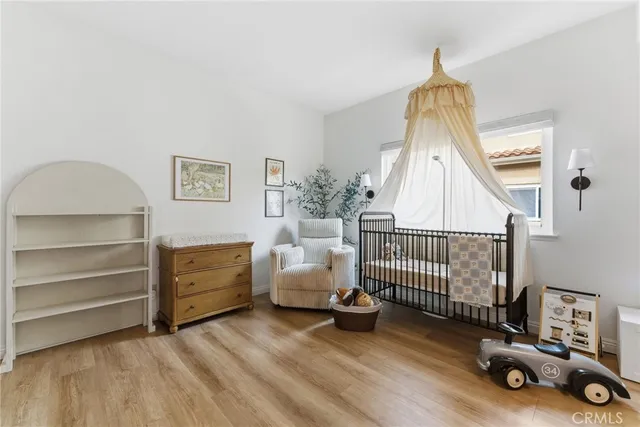 a bedroom with furniture and a window