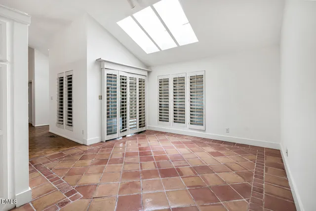 a kitchen with stainless steel appliances granite countertop a stove and a sink