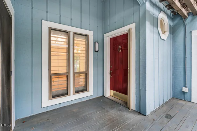 a view of front door with wooden floor