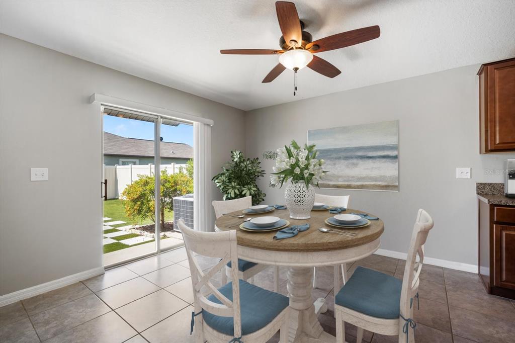 9607 Lemon Drop Loop Ruskin, FL 33573 - Photo 11 of 31 a dining room with furniture and window