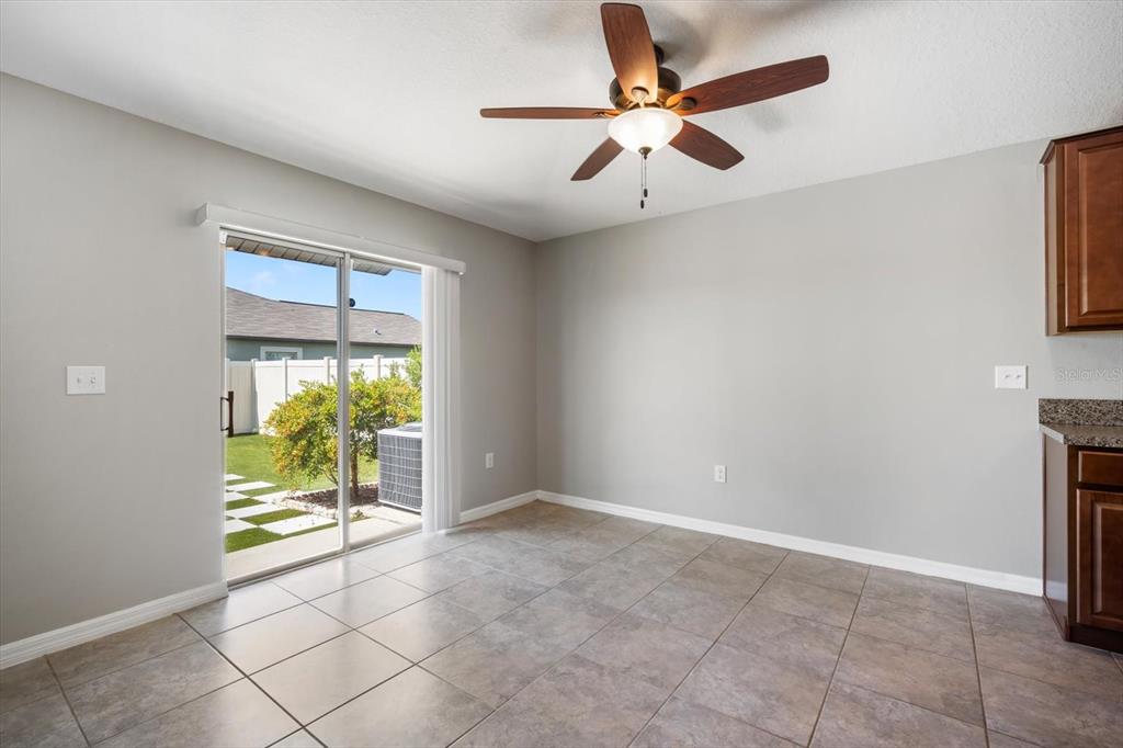 9607 Lemon Drop Loop Ruskin, FL 33573 - Photo 12 of 31 a view of an empty room with a window