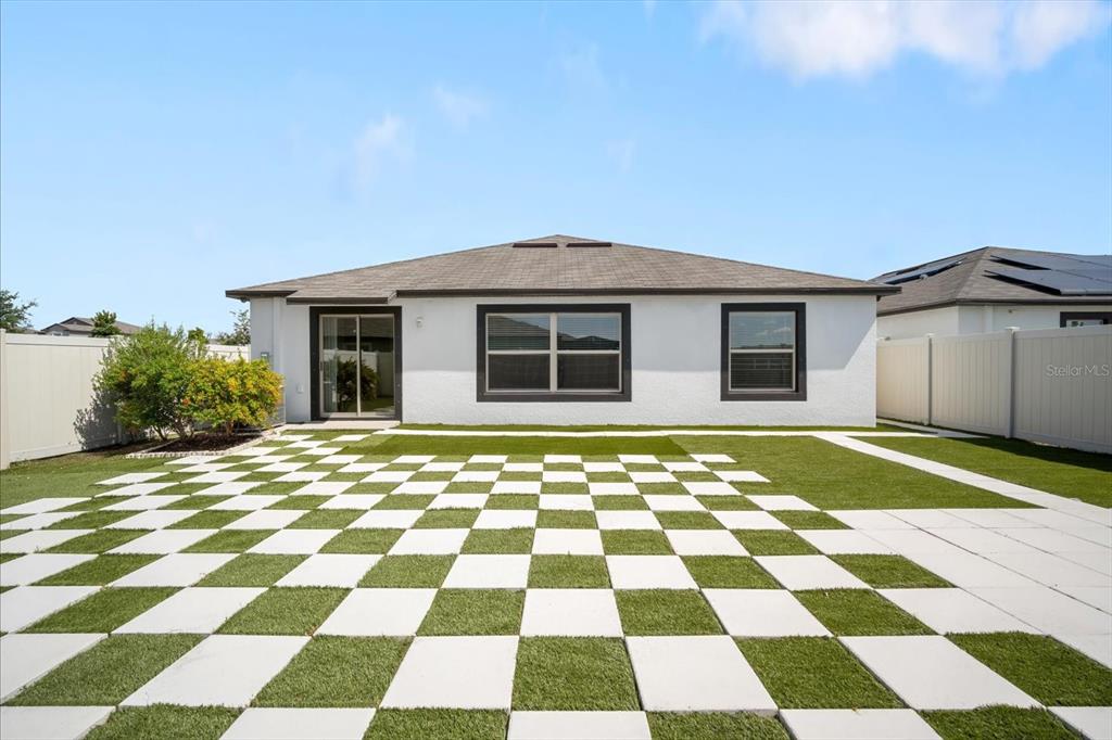 9607 Lemon Drop Loop Ruskin, FL 33573 - Photo 2 of 31 a black and white checkered floor with a black white checkered floor