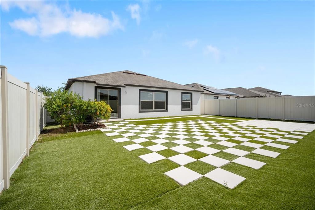 9607 Lemon Drop Loop Ruskin, FL 33573 - Photo 23 of 31 a bathroom with a sink and a yard