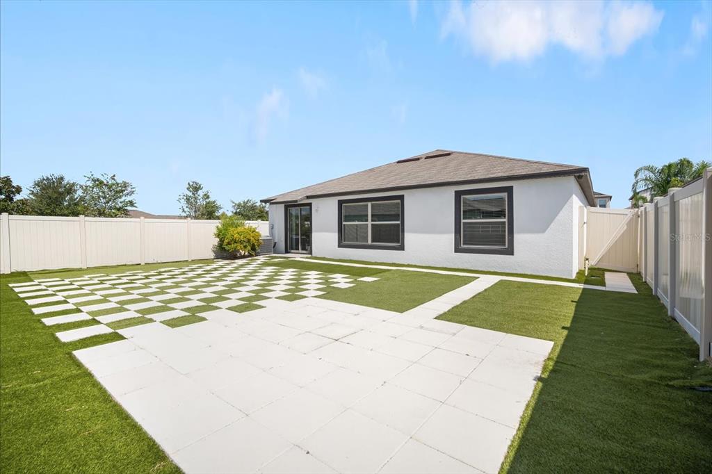 9607 Lemon Drop Loop Ruskin, FL 33573 - Photo 24 of 31 a front view of a house with a yard