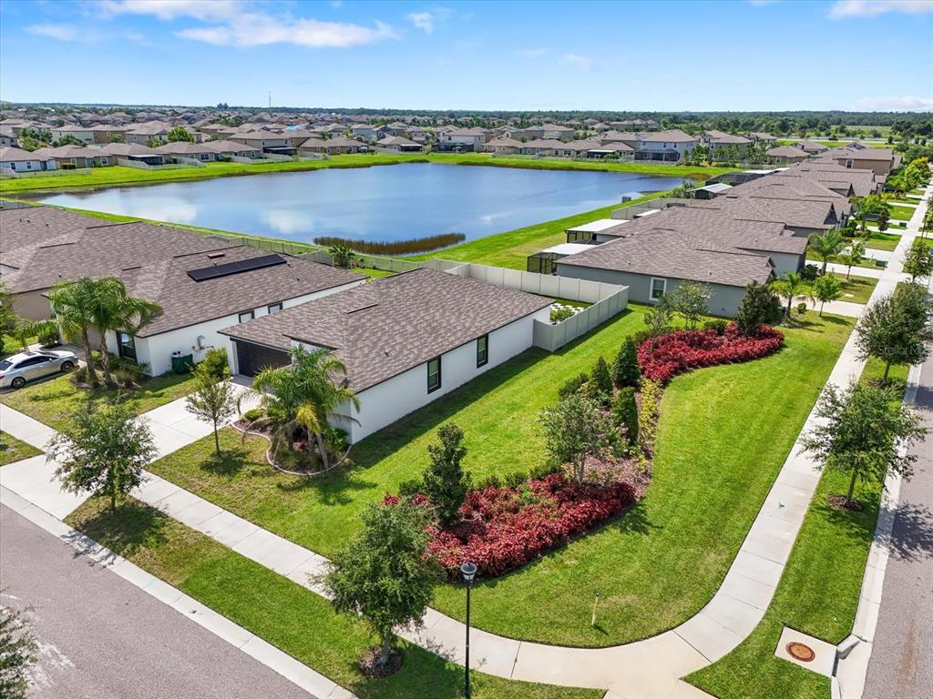 9607 Lemon Drop Loop Ruskin, FL 33573 - Photo 26 of 31 an aerial view of a house with a swimming pool yard and outdoor seating