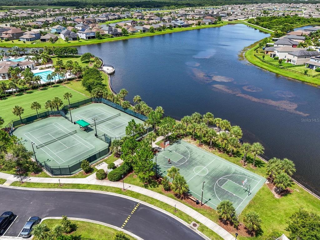 9607 Lemon Drop Loop Ruskin, FL 33573 - Photo 31 of 31 an aerial view of a house a yard and lake view