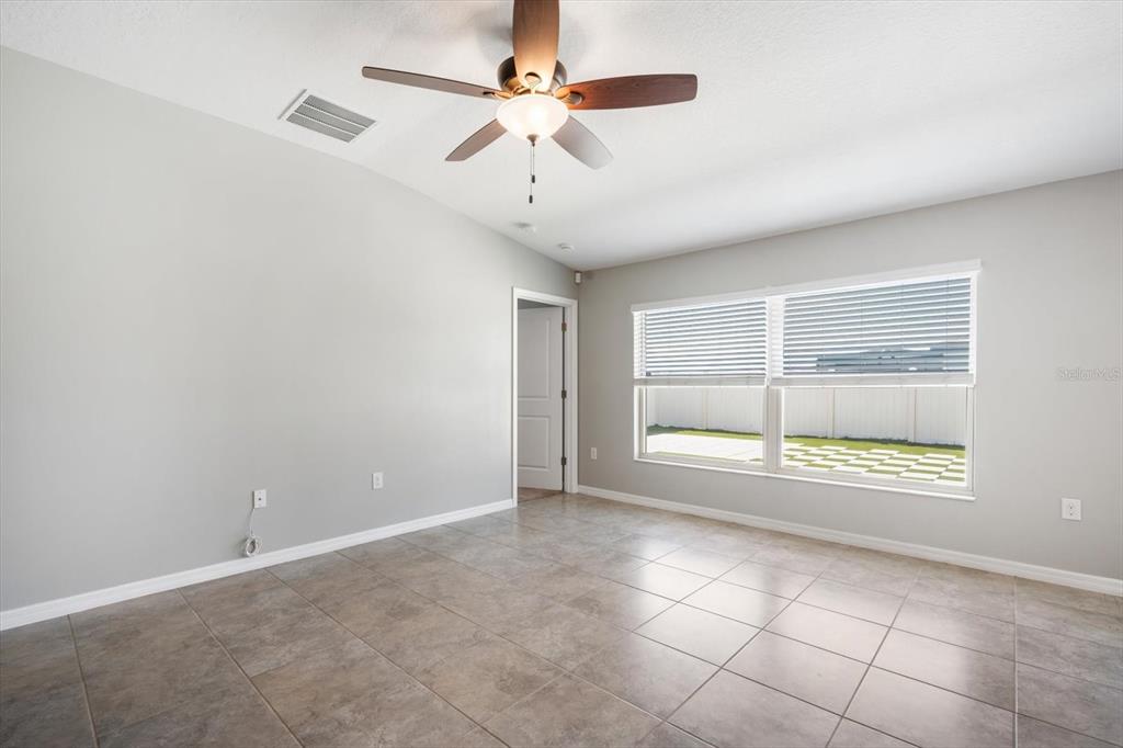 9607 Lemon Drop Loop Ruskin, FL 33573 - Photo 5 of 31 a view of an empty room with a window