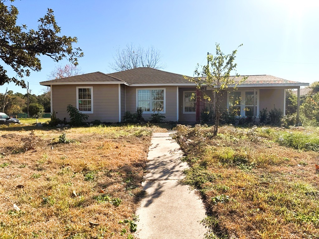 7430 Claiborne Street Houston, TX 77016 - Photo 21 of 23 a front view of a house with a yard covered with snow