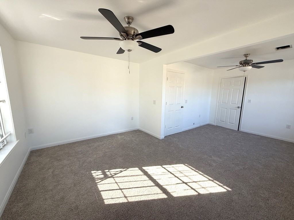 7430 Claiborne Street Houston, TX 77016 - Photo 7 of 23 a view of a livingroom with a ceiling fan and window
