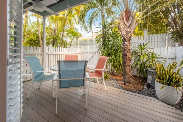 a view of a chairs and table in the patio