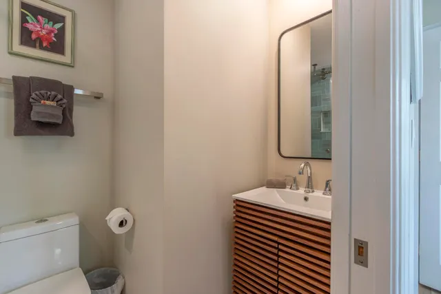 a bathroom with a toilet and a shower
