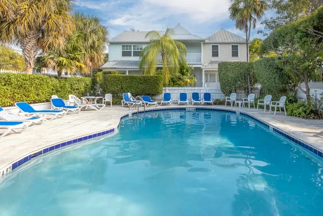a view of a swimming pool with a lounge chairs
