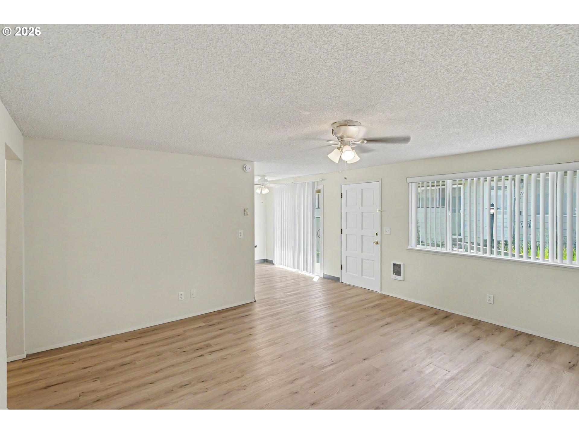 777 Boone Road Southeast, Unit 12 Salem, OR 97302 - Photo 4 of 16 a view of an empty room with wooden floor