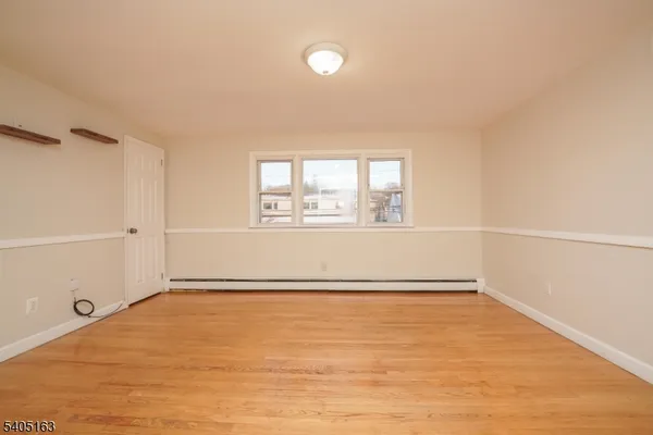 an empty room with a empty space and windows