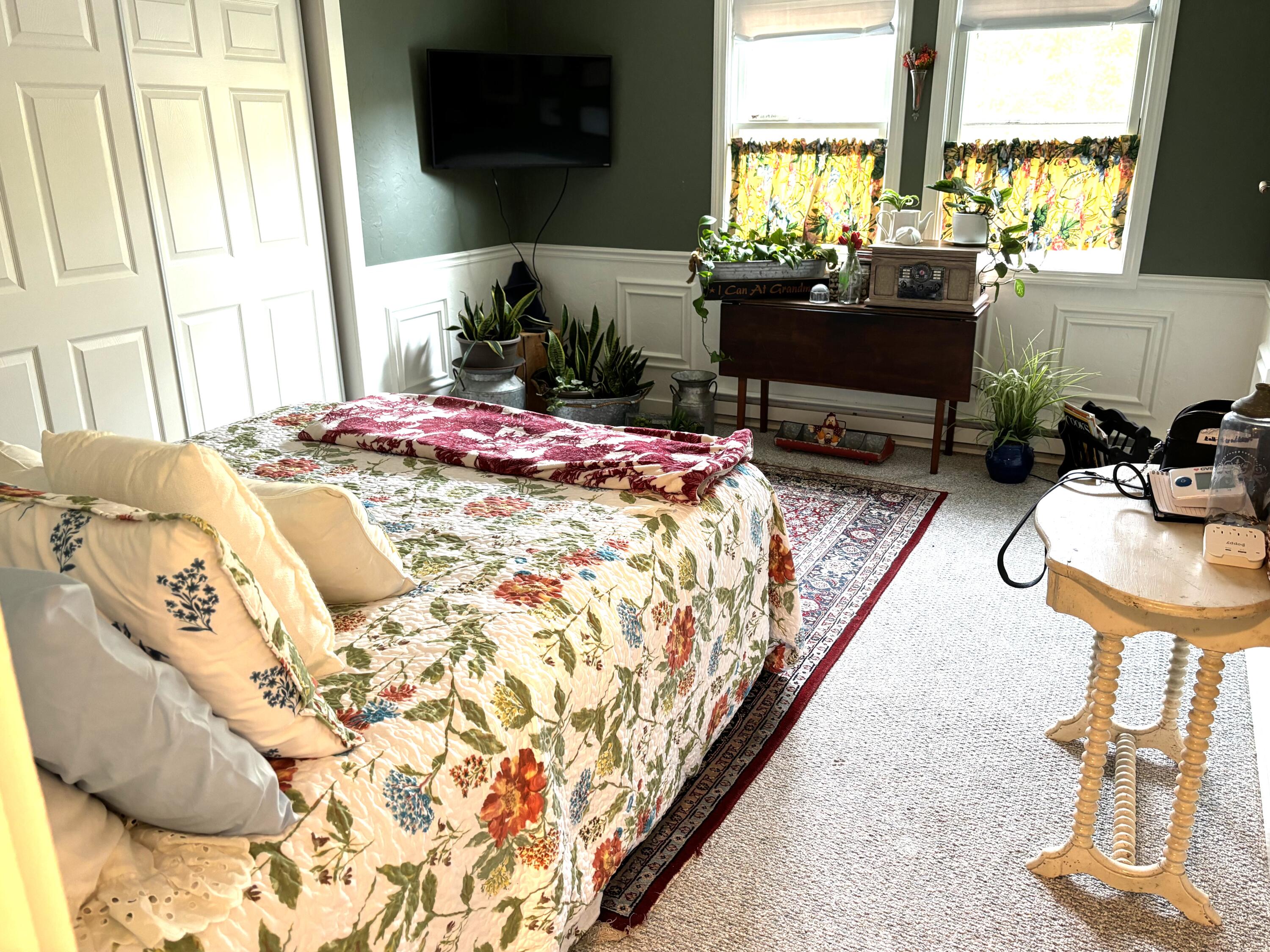 300 Falmouth Road, Unit 2C Mashpee, MA 02649 - Photo 11 of 14 a bed sitting in a bedroom next to a window