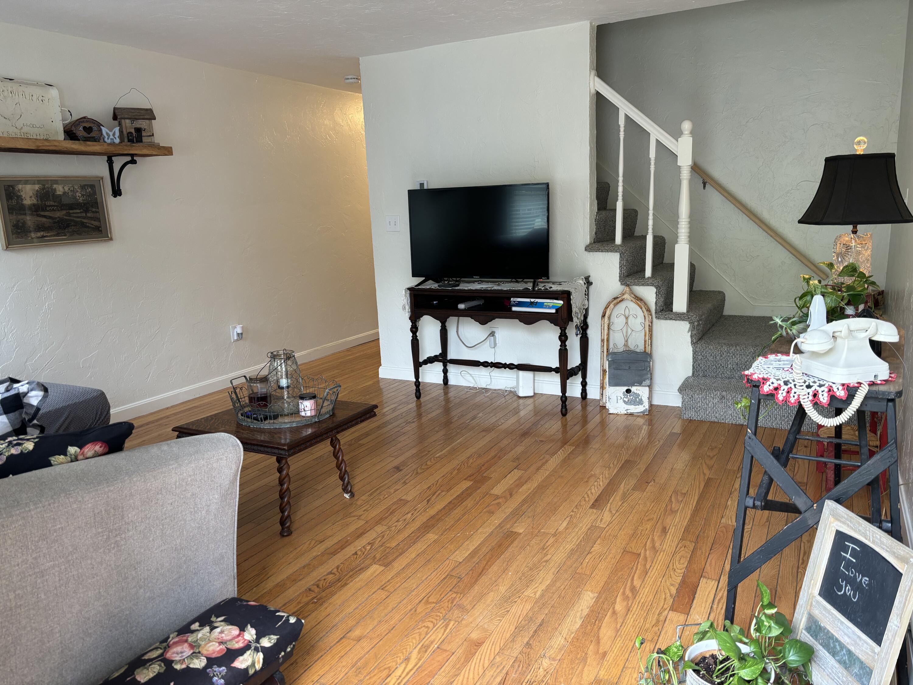 300 Falmouth Road, Unit 2C Mashpee, MA 02649 - Photo 2 of 14 a living room with furniture and a flat screen tv