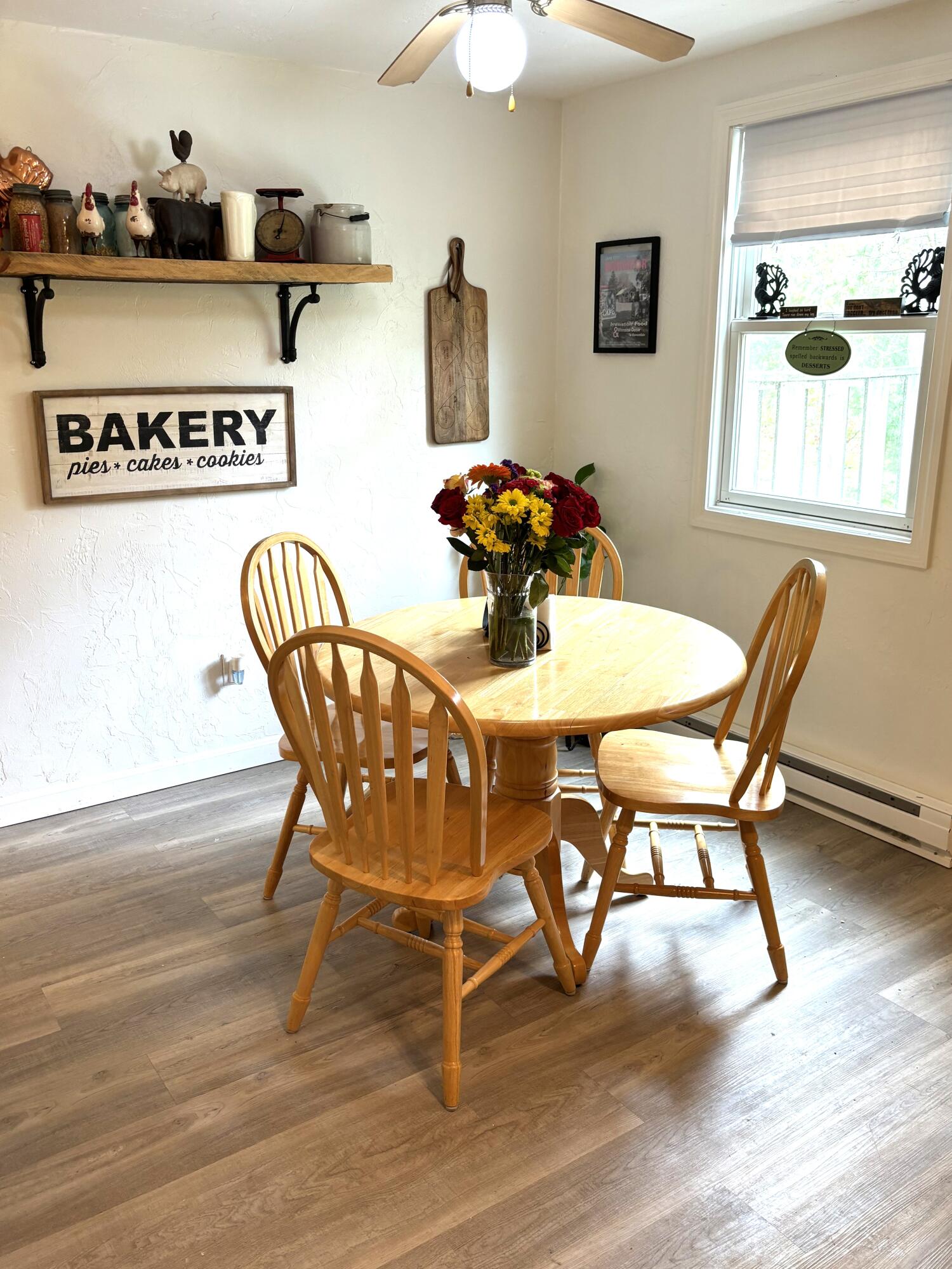 300 Falmouth Road, Unit 2C Mashpee, MA 02649 - Photo 4 of 14 a view of a dining room with furniture and wooden floor