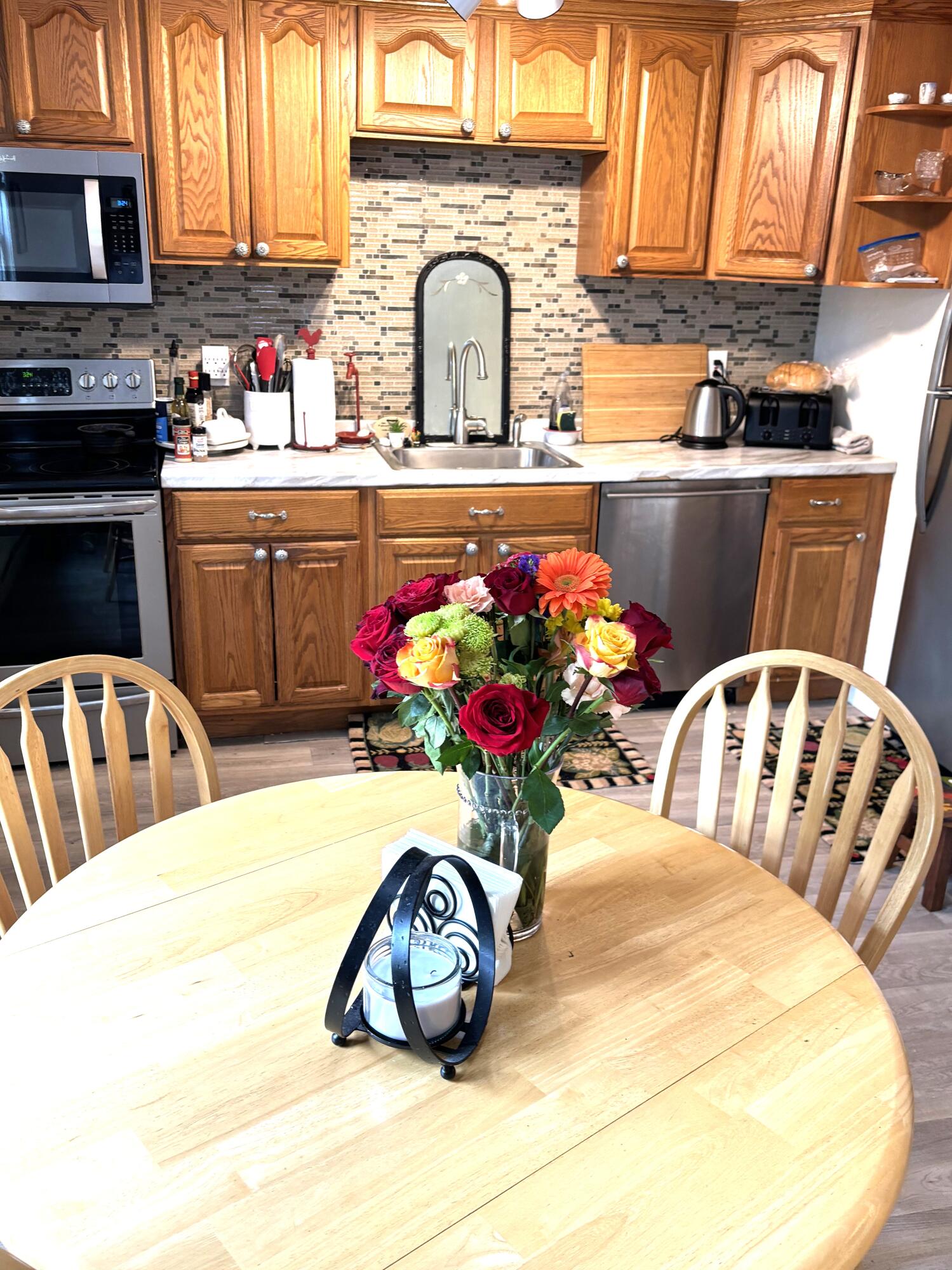 300 Falmouth Road, Unit 2C Mashpee, MA 02649 - Photo 5 of 14 a kitchen with a sink appliances and cabinets