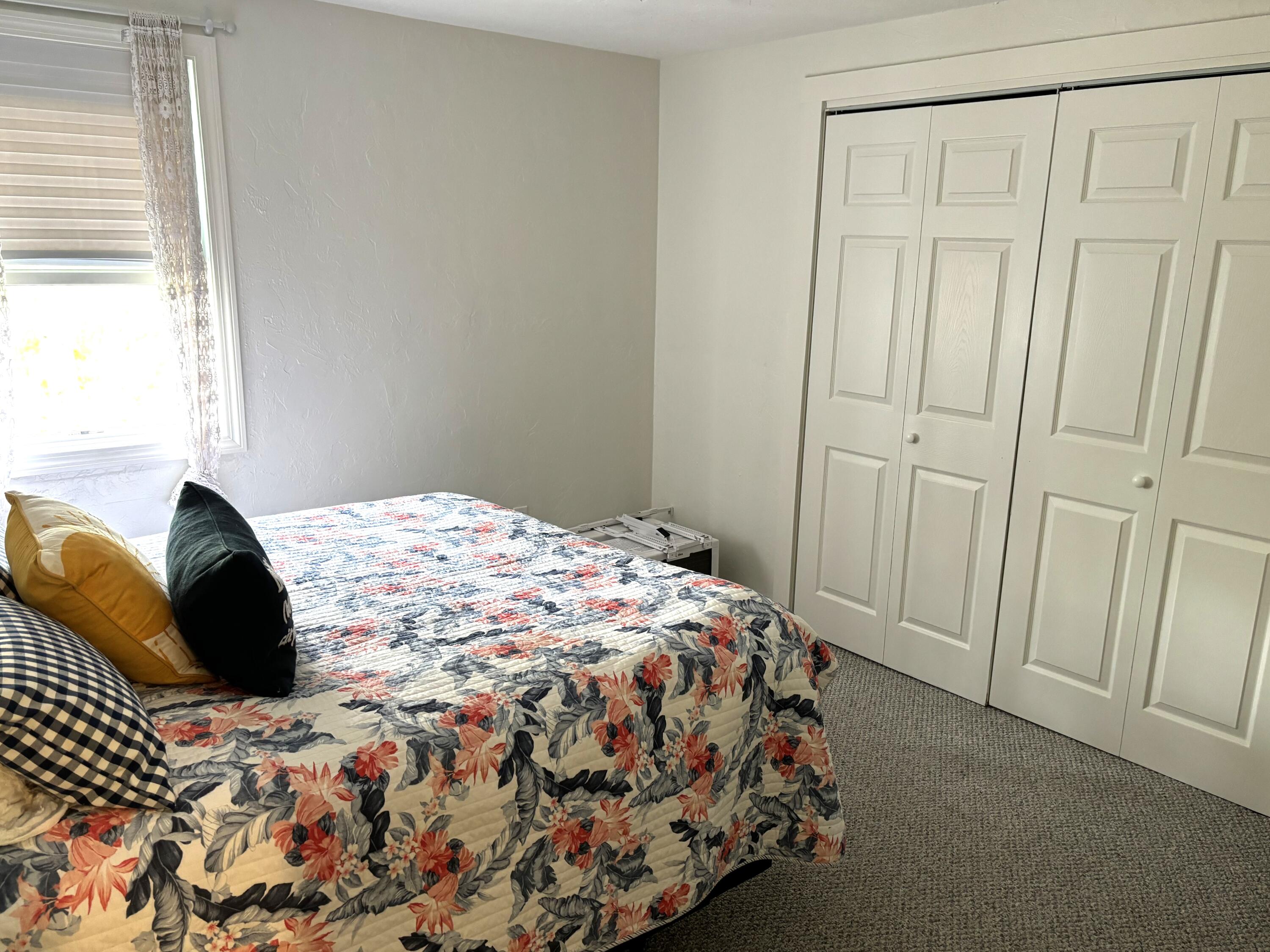 300 Falmouth Road, Unit 2C Mashpee, MA 02649 - Photo 8 of 14 a bedroom with a bed and a window