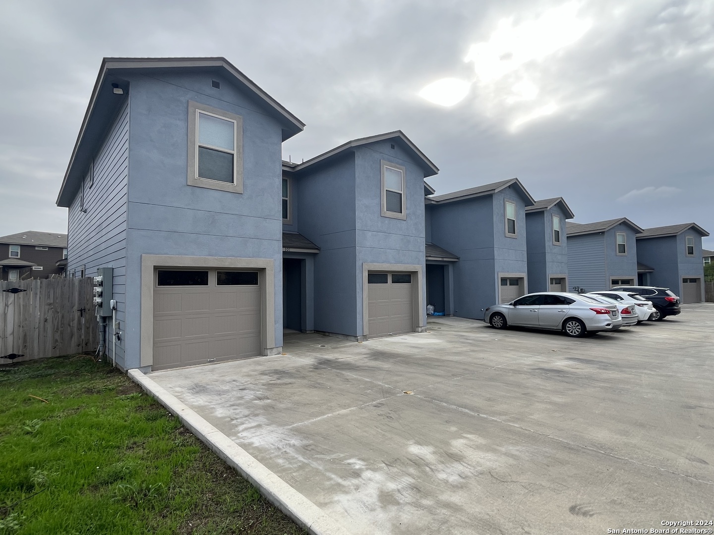 a view of a house with a yard and garage