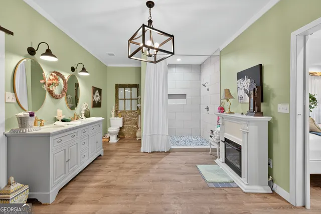 a view of living room with furniture and a fireplace
