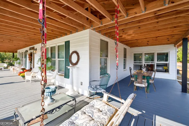 a view of a house with swimming pool and a yard