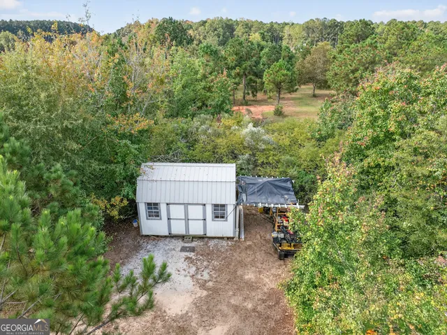 a view of a swimming pool with a yard