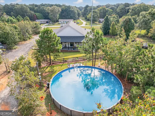 a view of a city with lush green forest